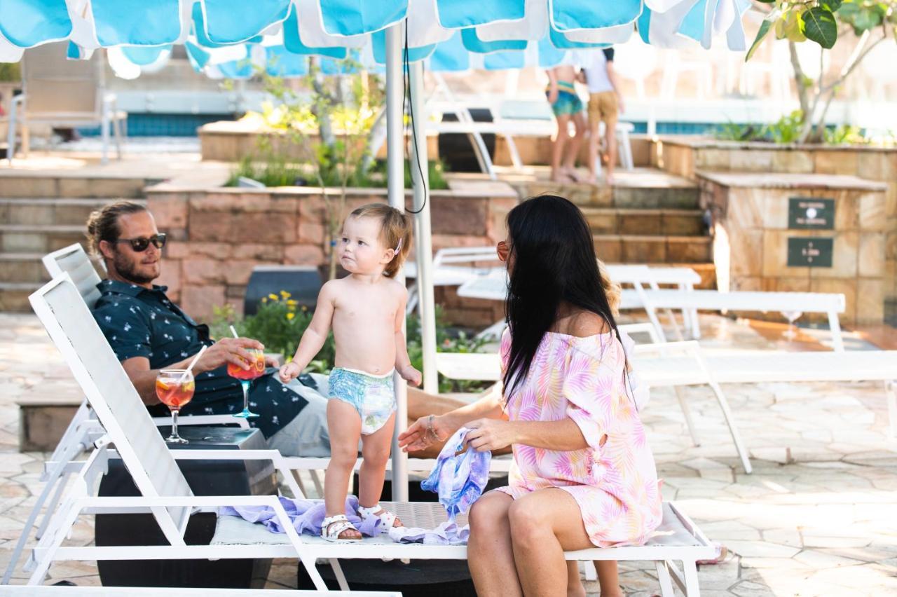 The Capital Zimbali Hotel Ballito Kültér fotó Family at the pool