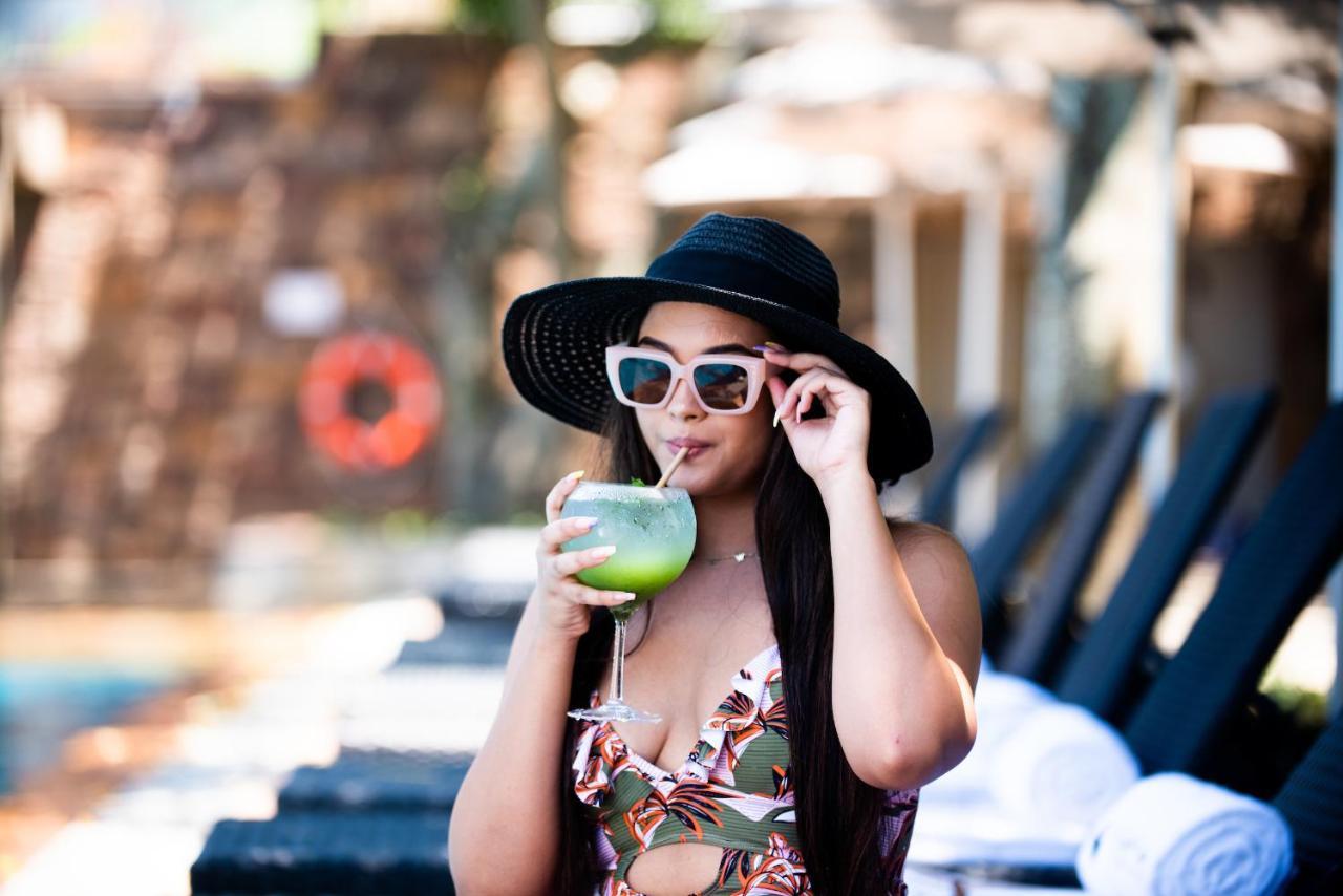 The Capital Zimbali Hotel Ballito Kültér fotó A woman wearing a hat
