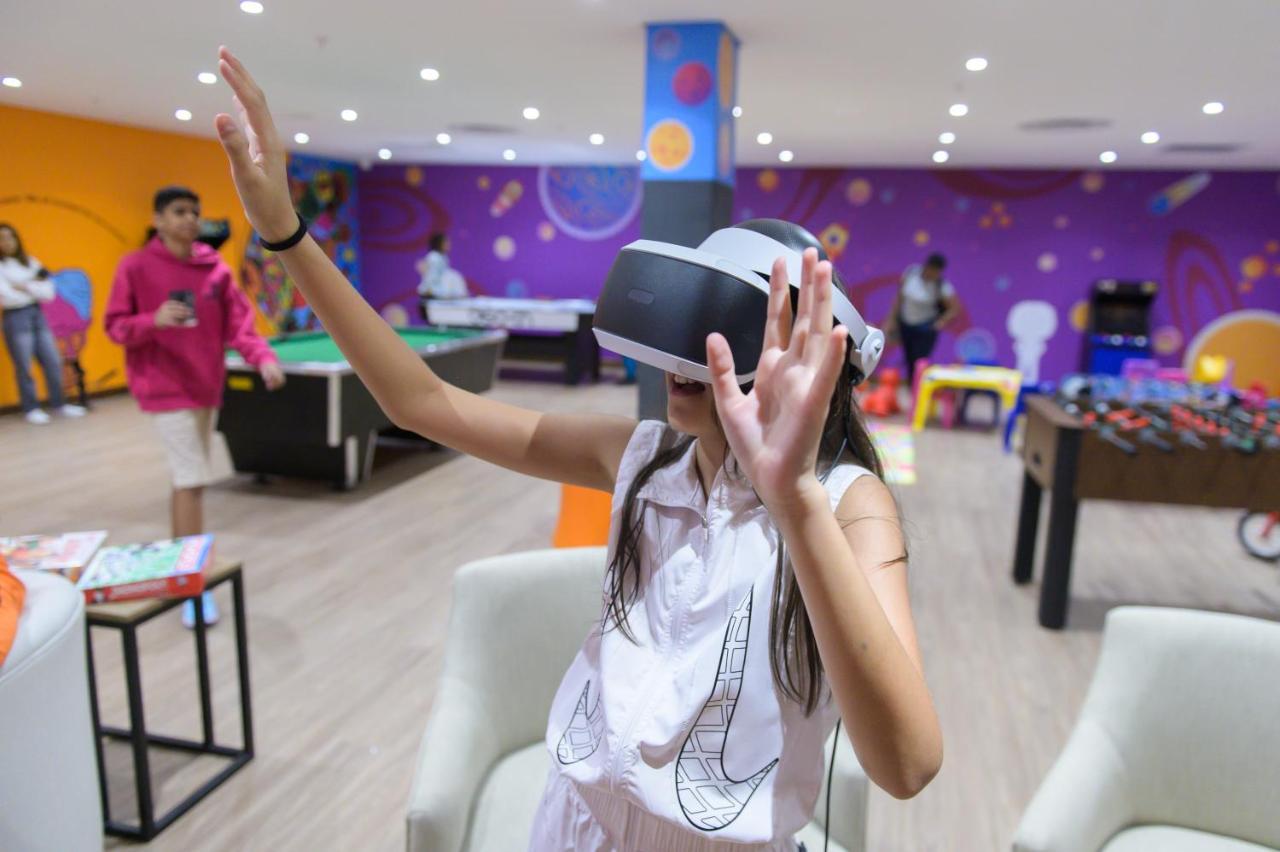 The Capital Zimbali Hotel Ballito Kültér fotó A child using a PlayStation VR headset
